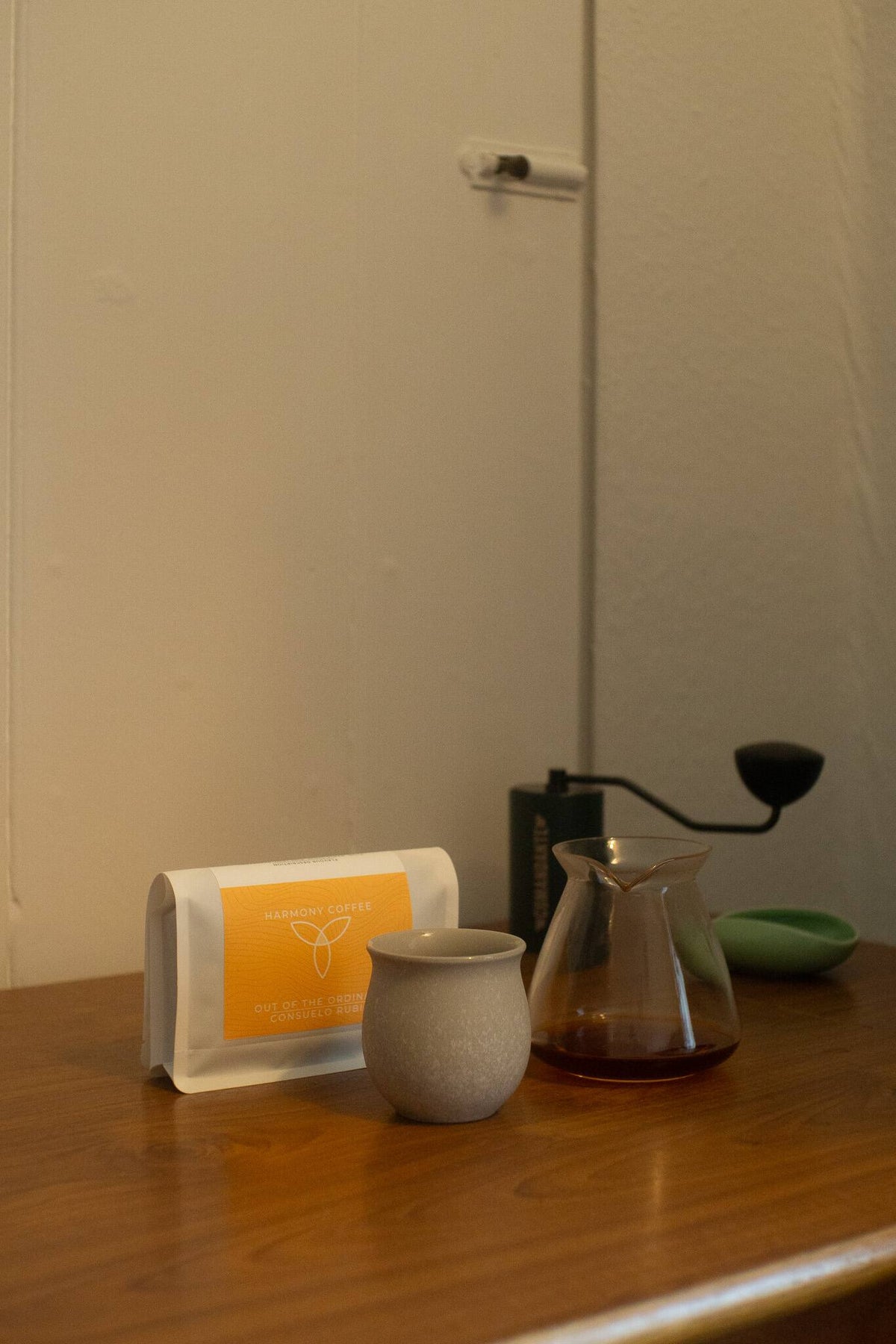 Arrangement of Consuelo Rubio on table with cup and carafe