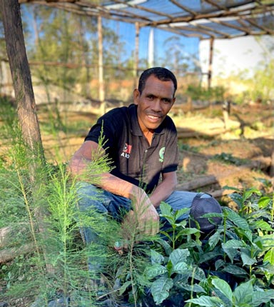 Maun Simao from Karst Organics in a model coffee farm In Letefoho, East Timor.