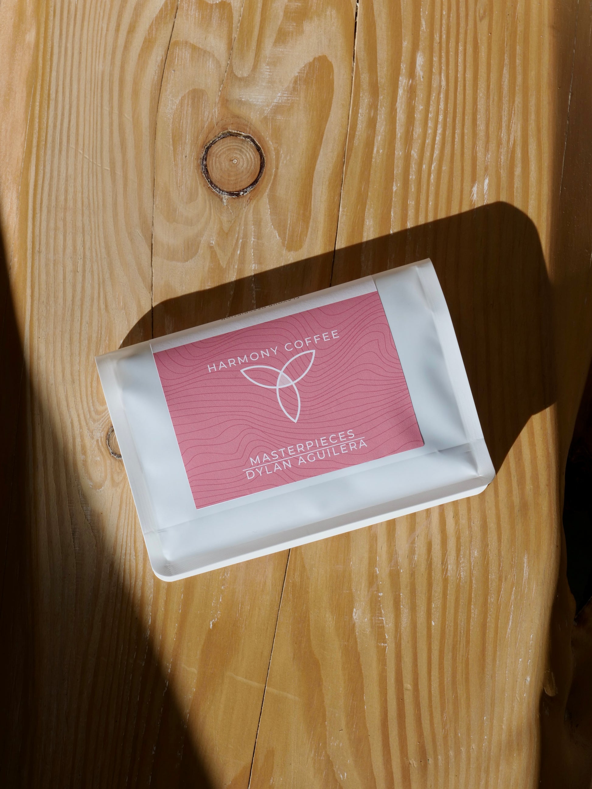 Harmony Coffee package on a wooden surface