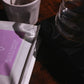 Harmony Coffee package Brayan Smith with a coffee filter and mug on a wooden surface