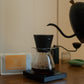 Gooseneck kettle pours water into an Orea with Consuelo Rubio Anaerobic sidra coffee.
