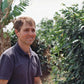 Paulo Agualetti from Sitio Agua Fria standing among his coffee trees.