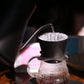 Close-up of a coffee brewer with a blurred background