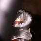 Close-up of a coffee filter with coffee grounds inside a coffee filter.