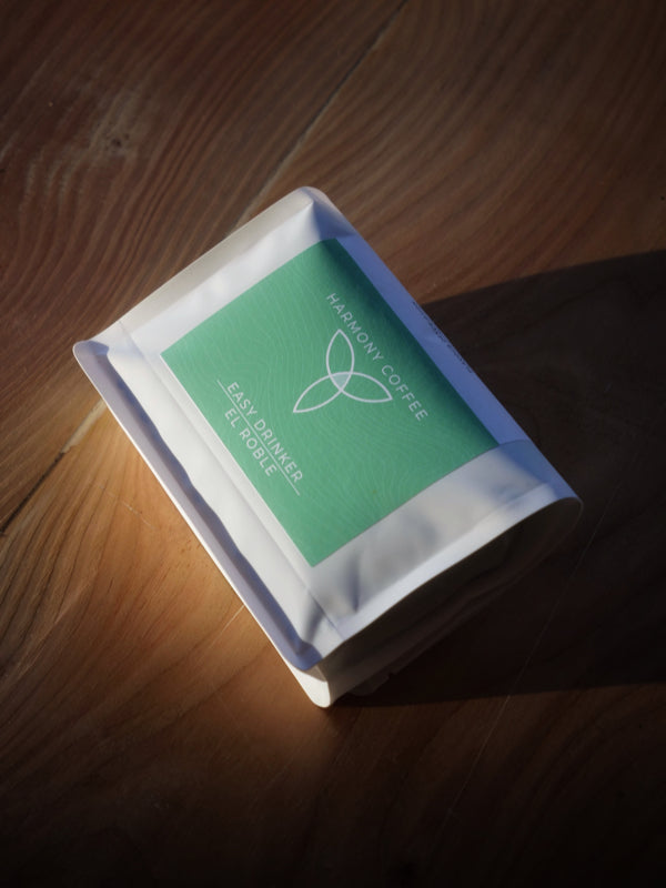 El Roble by Dylan Aguilera - Single Origin Costa Rican coffee sat on a wooden bench in good lighting. Roasted By Harmony Coffee York