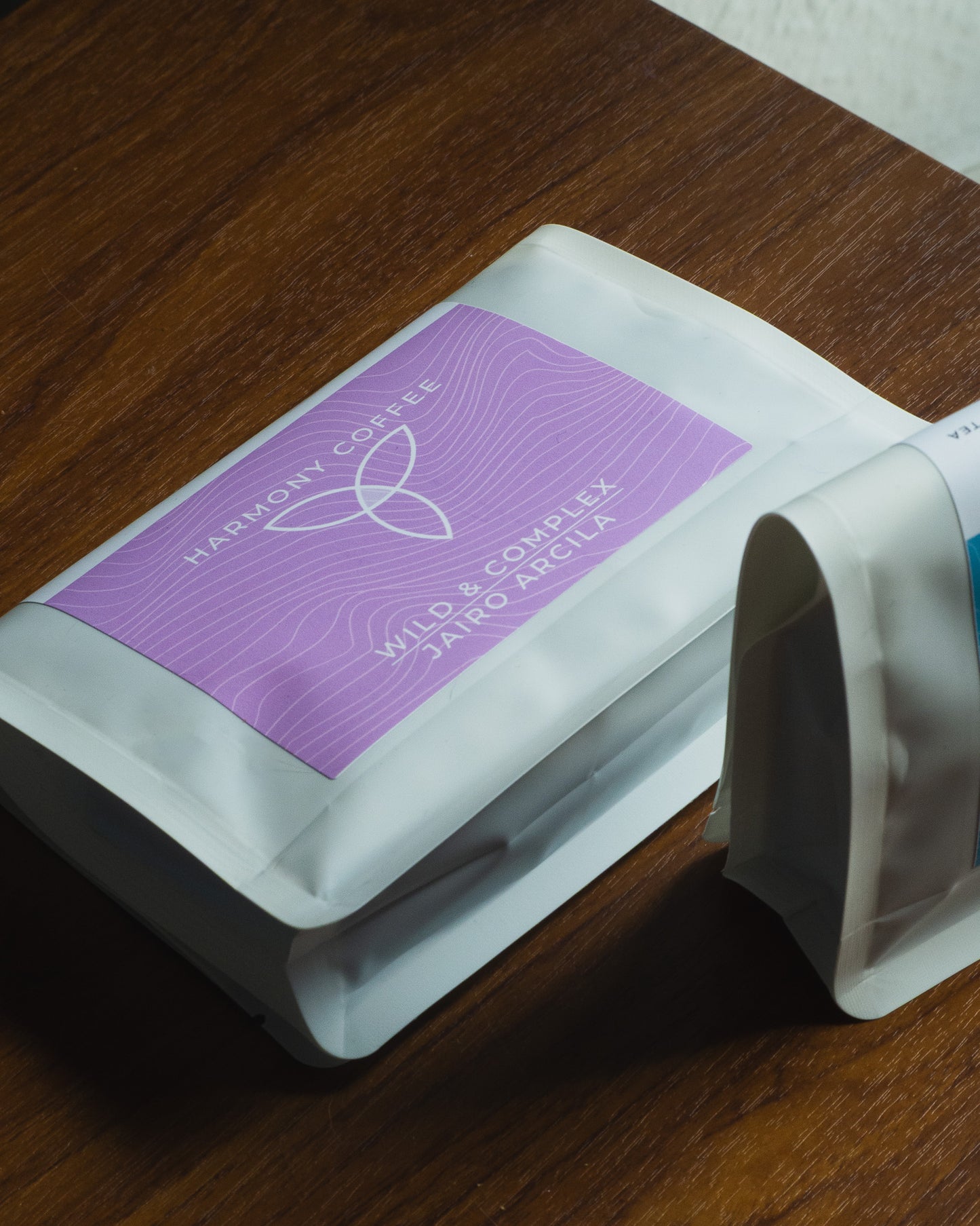 Harmony Coffee package of Jairo Arcila Natural Chiroso on a wooden surface