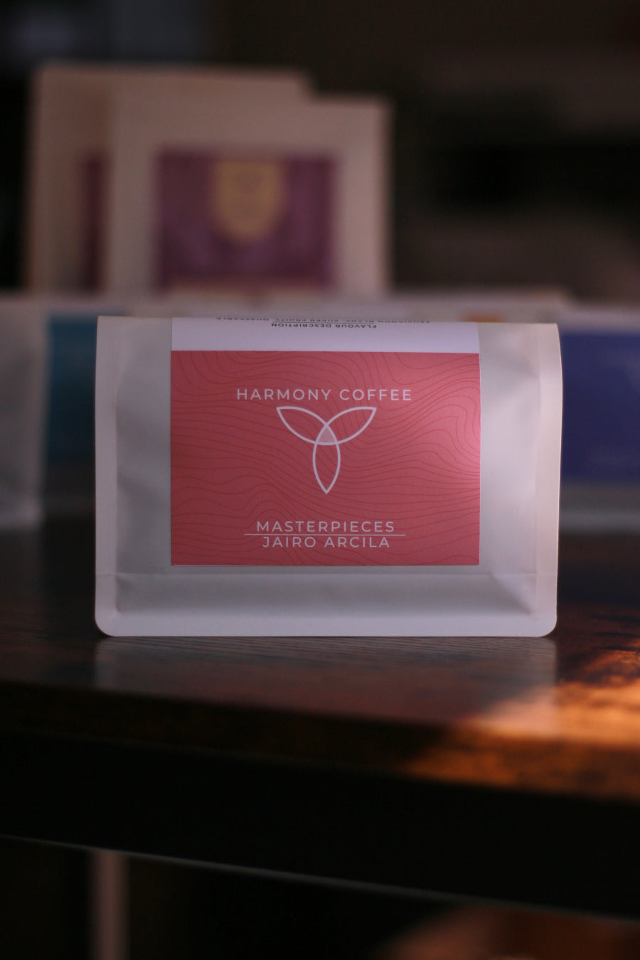 Harmony Coffee package of Jairo Arcila Java, on a dark surface with blurred background