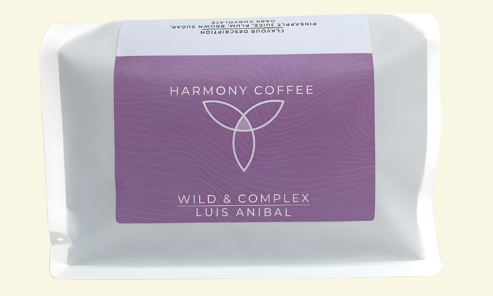 Harmony Coffee package with purple label on a beige background