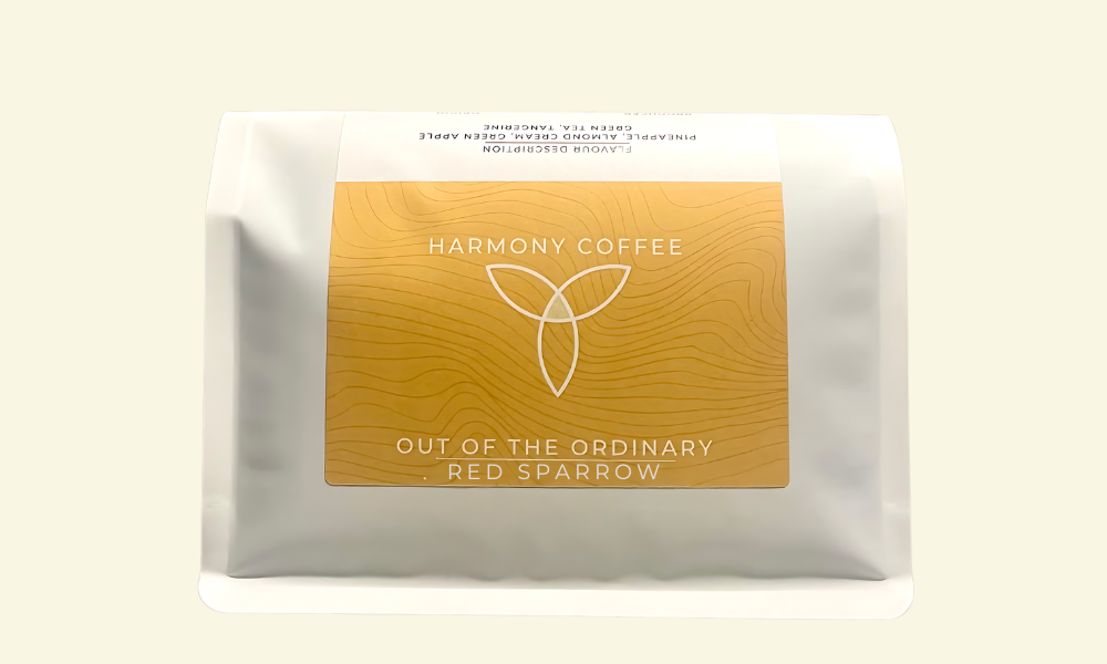Harmony Coffee package with gold label on a beige background