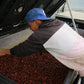 Alfonso from San Augustin sorting through a container of red Sidra coffee cherries.