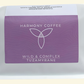 Harmony Coffee package with purple label on a light beige background. Tuzamyrane from Rwanda.