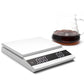 Felicita scales with a glass of coffee on a white background